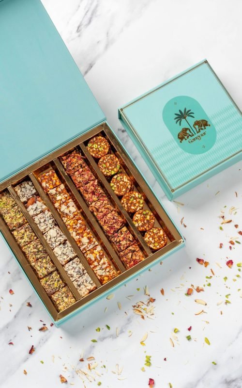 Turquoise Gangour Aranya mithai box with golden elephant and palm tree design